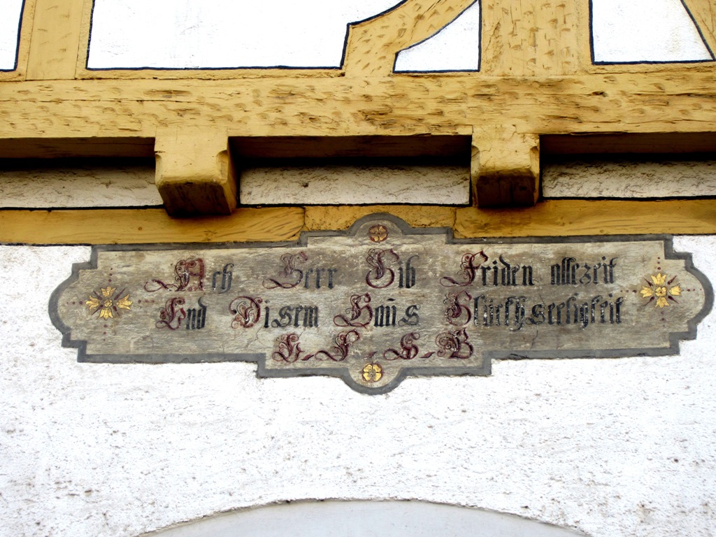 "Ach Herr gib Friden allezeit und disem Haus Glückseligkeit."  "Oh Lord give peace for all time and in this house blissful happiness." Blaubeuren, Germany